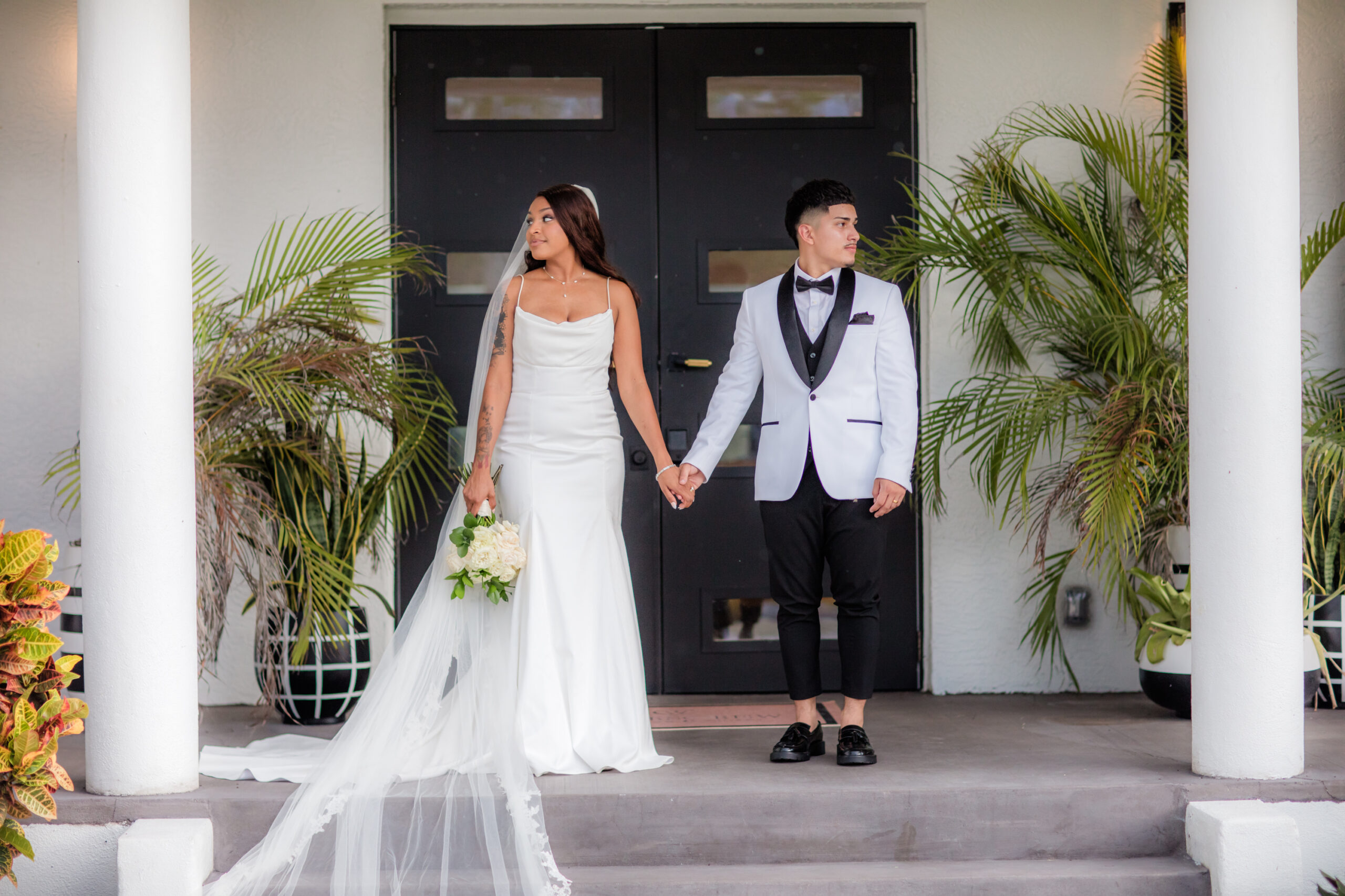 Couples Portraits on wedding day in front of Corkscrew Weddings and Winery