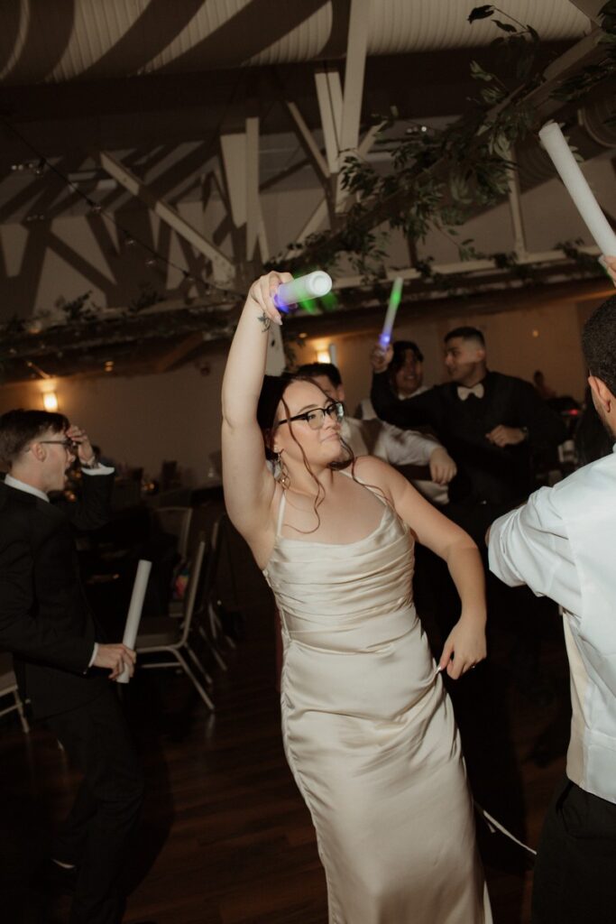 This image is of a Bride and Groom having fun at their reception.