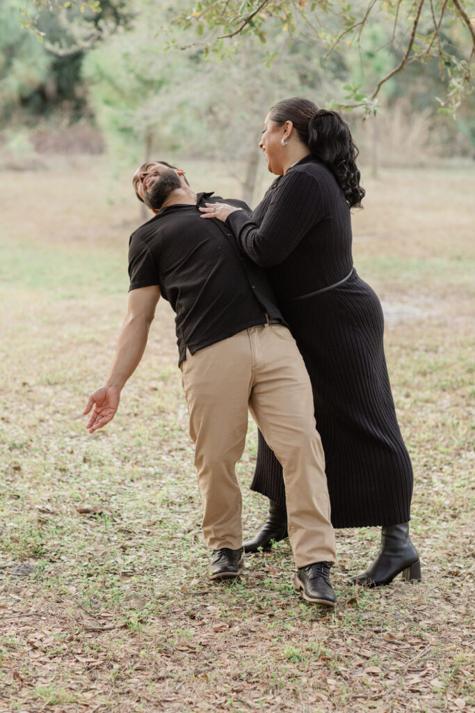 Fort Myers Engagement: Couples is having fun being silly.