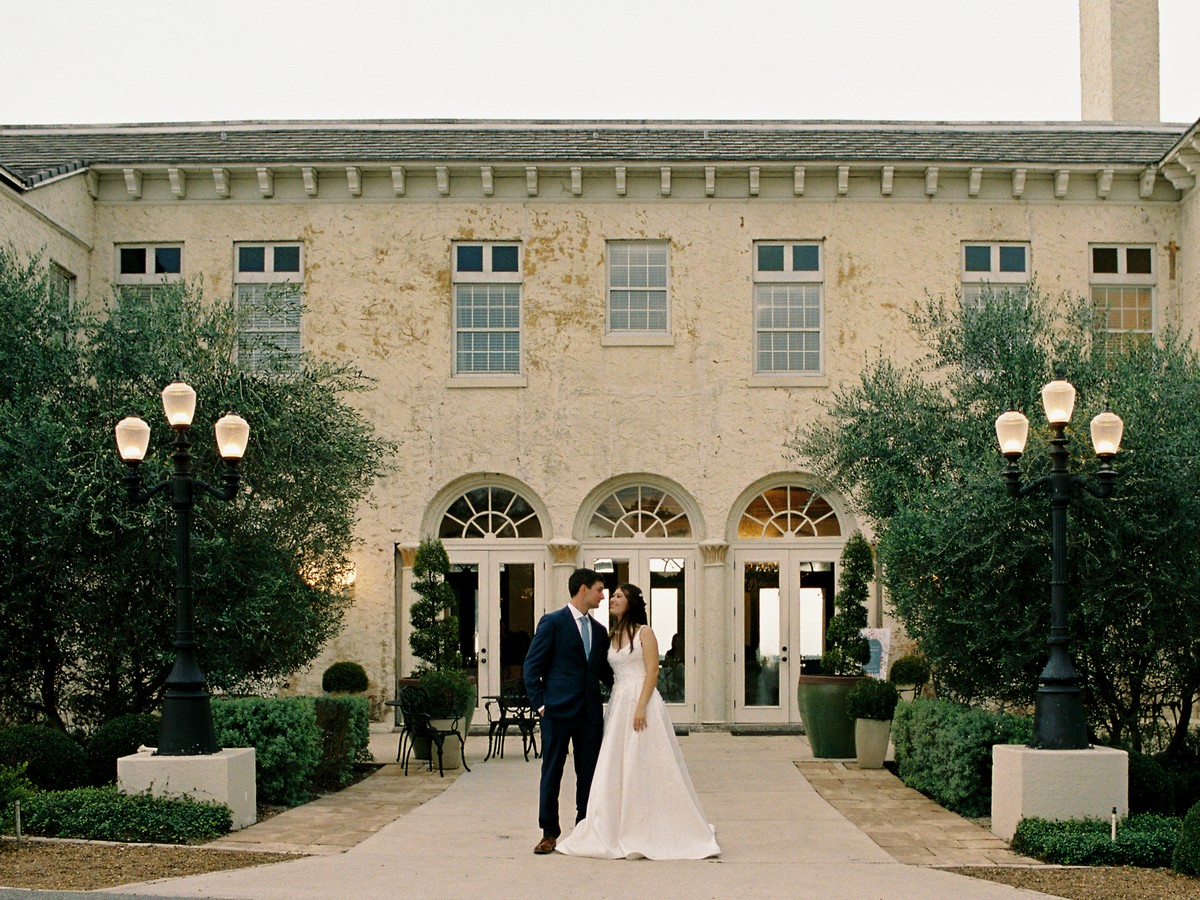 Bride & Groom in front of the venue